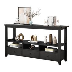 a black console table with drawers underneath it