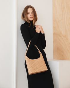 Vogue called it the minimalist, quiet luxury staple for fall, and we agree. With a structured shape and single strap, it’s lightly inspired by the baguette style of the 90s and 00s. Soft, woven leather in a square pattern, like a natural check. Wear it everyday with a cashmere coat and boots for a chic fall uniform, an Elegant Woven Leather Shoulder Bag For Work, Classic Intrecciato Shoulder Bag For Everyday, Classic Everyday Shoulder Bag With Intrecciato Weave, Modern Woven Leather Shoulder Bag For Work, Classic Intrecciato Weave Shoulder Bag For Everyday, Classic Intrecciato Weave Everyday Shoulder Bag, Modern Pouch Shoulder Bag With Braided Handles, Business Shoulder Bag With Braided Handles, Woven Leather Shoulder Bag For Work