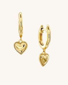 No better way to show someone you love them or express self-love than with these heart pendant huggies. Available in 925 sterling silver and 18k yellow gold plated. Heart: 6 x 6.2 mmHoop Height: 10.8 mmHoop Thickness: 1.8 mm Valentine's Day Huggie Dangle Earrings With Heart Charm, Valentine's Day Heart Charm Dangle Huggie Earrings, Valentine's Day Dangle Huggie Earrings With Heart Charm, Valentine's Day Heart Huggie Earrings, Valentine's Day Sterling Silver Huggie Earrings, Valentine's Day Yellow Gold Huggie Jewelry, Sterling Silver Huggie Earrings For Valentine's Day, Valentine's Day Tarnish Resistant Huggie Earrings, Dainty Yellow Gold Huggie Earrings With Heart Charm