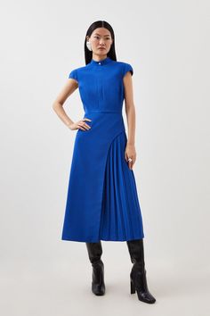 Elevating Smart Closets, This Tailored Dress Is Crafted From Premium Crepe Fabric. Featuring A High Neck With A Single Polished Button Detail And Cap Sleeves, While An A-Line Skirt Is Cut To A Midi Length With A Pleated Panel For Classic Detailing. Pair With Knee-High Boots For Elevated Workwear. Midi Dresspleated Detailinghigh Neckcrepe Dresses For Office Work Wear, Blue Wedding Guest Dress Winter, Professional Dress Women, Work Style Women, A Line Dresses For Women, Elevated Workwear, Pleated Outfit, Dress Boots Outfit, Teal Midi Dress