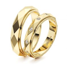 two gold wedding rings with diamonds on them