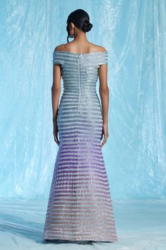 Multi-colored lurex padded maxi gown with hand embroidered gradient-dyed glass yarns.
Component: 1
Pattern: Embroidered
Type Of Work: Hand
Neckline: Off Shoulder
Fabric: Body : Lurex (60% Metallic Fibre 40% Polyester) + Glass Yarns (100% TPU), Lining : Satin (66% Viscose 34% Modal)
Color: Multi Color
Other Details: 
Closure : Centre back zipper
Occasion: Cocktail - Aza Fashions Multicolor Floor-length Evening Gown, Multicolor Gown With Fitted Bodice For Evening, Multicolor Evening Gown With Fitted Bodice, Elegant Multicolor Sequin Gown, Formal Multicolor Floor-length Evening Dress, Multicolor Maxi Gown For Gala, Multicolor Floor-length Evening Dress For Gala, Gradient Gown, Body Lurex