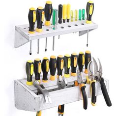 there are many tools that are on the shelf and in the tool holder, which is holding several different types of screwdrivers