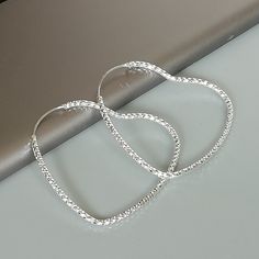 IMPORTANT **Please go through all the pictures i have posted for a listing with a ruler, on a model, on my hand, to get an exact idea of the actual size of the item.A PAIR of sterling silver delicate and lightweight heart shaped hoops. Dimension: 4.5 x 4.1 cm Weight: 2.8gm/ pair Price listed is for a PAIR of hoops. These earrings are made of 925 hypoallergenic sterling silver Can be packaged in a gift box. I can include a personal message from you if needed You are welcome to contact me at... bh Silver Open Heart Hoop Earrings As Gift, Sterling Silver Heart Hoop Earrings, Silver Hypoallergenic Hoop Heart Earrings, Silver Heart-shaped Hoop Earrings Gift, Silver Sterling Heart-shaped Hoop Earrings, Bohemian Jewelry Gift, Modern Bracelets, Earrings Bohemian, Skull Earrings