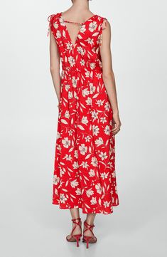 Whether heading to brunch or a garden party, you'll look effortlessly charming in this flowy maxi dress covered in romantic blooms and detailed with dainty ties at the shoulders. Slips on over head Surplice V-neck Sleeveless 85% viscose, 15% polyamide Machine wash, line dry Imported Feminine Red Maxi Dress For Vacation, Red Floral Print Maxi Dress For Daywear, Red Rayon Midi Dress For Spring, Sleeveless Rayon Maxi Dress For Garden Party, Red Maxi Dress For Summer Garden Party, Spring Red Rayon Maxi Dress, Red Rayon Maxi Dress For Spring, Red Spring Maxi Dress For Daywear, Red Floral Print Maxi Dress For Spring