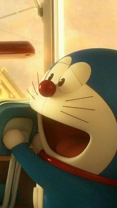 a cartoon character sitting in a blue chair with his mouth open and tongue hanging out