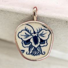 This handmade pendant is a true work of art, crafted from a unique piece of broken china, carefully set in a gleaming fine silver bezel. Each pendant is one-of-a-kind, preserving the delicate details and history of the original china pattern, making every piece a small story from the past. The sterling silver bail completes the design with a touch of elegance, adding durability and beauty. Carefully crafted by hand, this pendant is perfect for those who appreciate sustainable, meaningful jewelry Ming Tree, Artisan Jewelry Necklaces, Broken China Jewelry, China Jewelry, Tree Necklace, Broken China, Meaningful Jewelry, Handcrafted Artisan Jewelry, Floral Necklace