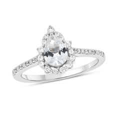 Start your endless love story with this unique pear-shaped white lab-created sapphire and diamond pointed frame engagement ring in white gold. Crafted in cool 10K white gold This design features a 7.0 x 5.0mm pear-shaped shimmering white lab-created sapphire at the center. The frame sparkles with alternating diamond duos and larger single diamonds. Diamonds and beaded detailing line the shank. This engagement ring delights with 1/5 ct. t.w. of diamonds. White Lab, Endless Love, Pear Shaped, Design Features, Love Story, Pear, Engagement Ring, Sapphire, Lab