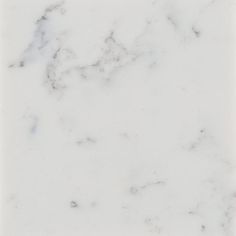 a white marble tile with grey veining