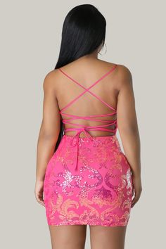 This Sequined V-neck Dress in a stunning, luxurious pink color features a sexy backless design with a zipper. The plain pattern is complemented by a cami style and spaghetti straps, creating an elegant and exclusive look. The sleeveless design and natural waistline accentuate the slim fit and pencil hemline, making it a must-have for any sophisticated wardrobe. Crafted from high-quality sequins and a slight stretch fabric, this dress is both luxurious and comfortable. 95% Polyester, 5% Elastane Glamorous Sleeveless Mini Dress With Lace-up Back, Pink V-neck Mini Dress For Prom, Glamorous Tie-back Mini Dress For Prom, Glamorous Tie Back Mini Dress For Prom, V-neck Mini Dress With Corset Back For Date Night, Pink Backless Dress With Back Zipper, Pink Sleeveless Mini Dress With Lace-up Back, Party Mini Dress With Sweetheart Neckline And Tie Back, Sweetheart Neckline Mini Dress With Tie Back For Party