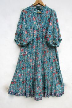 "ITEM DESCRIPTION teal green flower printed maxi dress - v neckline summer maxi dress - 3/4th sleeve with button maxi dress Features: 3/4th sleeve, V neck, Long dress Material: Cotton cambric Fabric: 100% cotton soft light weight ethnic print fabrics  Sleeve Length = 18 inch For more sizes & their measurement, please refer our below chart to understand the sizes variations available with us For your size requirement, please mention your size in seller note at the time of buying. SIZE MEASUREMENT  BUSTLENGTHSHOULDER XXS34 inch51 inch13.5 inch XS36 inch51 inch14 inch S38 inch51 inch14.5 inch M40 inch51 inch15 inch L42 inch51 inch16 inch XL44 inch51 inch16.5 inch 2XL46 inch51 inch17 inch 3XL48 inch51 inch18 inch   Company Return Policy:  Please write for more information to my email directly Cambric Fabric Dresses, Green Half Sleeve Maxi Dress For Summer, Turquoise V-neck Maxi Dress For Summer, Turquoise Flowy Maxi Dress For Spring, Spring Turquoise Flowy Maxi Dress, Turquoise Floral Print Maxi Dress, Green 3/4 Sleeve Maxi Dress For Summer, Blue Bohemian Half Sleeve Maxi Dress, Turquoise Bohemian Maxi Dress With Floral Print