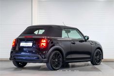 the back end of a black mini countryman