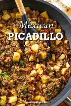 mexican picadillo in a skillet with a wooden spoon