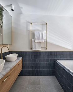 a bathroom with two sinks and a bathtub