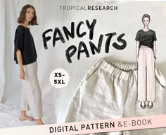 a woman in black shirt and pants standing next to a white backdrop with the words fancy pants