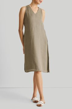 Introducing our Hemp V-Neck Straight Dress - an epitome of effortless elegance and minimalist chic. This midi-dress embodies modern sophistication with its clean lines and contemporary cut, embracing the essence of simplicity. Designed for versatility, it's a summer essential, perfect for various occasions. Its A-line fit offers comfort and style, while the V-neck and in-cut sleeves add a touch of allure. This stylish dress is complemented by functional pockets on both sides for practicality. Wa Leaves Dress, Reading Tea Leaves, Stylish Midi Dress, Tea Reading, Straight Dress, Green Midi Dress, Sustainable Fabrics, Tea Leaves, Womens Midi Dresses