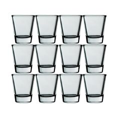 a set of twelve glasses sitting next to each other