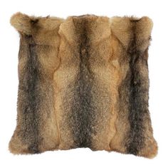 an animal fur pillow on a white background