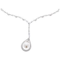 Nothing says elegance like the shimmering beauty of pearls! This gorgeous, brightly polished 18k white gold necklace features a white cultured pearl in the center, showcasing a high luster and pastel overtones complemented by a total of 241 round brilliant cut and baguette cut diamonds prong set in a decadent cluster cascade. Pearls are unique treasures from the sea, filled with an abundance of rich colors. White Gold Pear-shaped Necklace For Formal Occasions, Pear-shaped White Gold Necklace For Formal Occasions, Diamond White Pear-shaped Necklace For Formal Occasions, Classic Diamond Necklace With Pearl Chain For Formal Events, White Gold Jewelry With Pearl Charm For Evening, Classic Drop Necklace With Pearl Pendant For Formal Occasions, Classic Pearl Diamond Necklace For Formal Occasions, Classic Pearl Pendant Drop Necklace For Formal Occasions, Formal Silver Drop Necklace With Pearl Chain