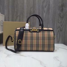 SHOP MORE LUXURY PRODUCTS HERE Description Burberry Small 1983 Check Link Bowling Bag Black/Brown For Women, Women’s Bags 9.1in/23cm Size : 23 x 13 x 16 cm / 9.1 x 5.3 x 6.5 inches (Length x height x width) A runway-inspired bowling bag with link detailing and a detachable shoulder strap, presented in metallic and our 1983 check ÃƒÂ¯Ã‚Â¿Ã‚Â½ÃƒÂ¯Ã‚Â¿Ã‚Â½ÃƒÂ¯Ã‚Â¿Ã‚Â½ÃƒÂ¯Ã‚Â¿Ã‚Â½ÃƒÂ¯Ã‚Â¿Ã‚Â½ÃƒÂ¯Ã‚Â¿Ã‚Â½ÃƒÂ¯Ã‚Â¿Ã‚Â½ÃƒÂ¯Ã‚Â¿Ã‚Â½ an archive plaid updated with subtle Equestrian Knight motifs. Thi Dior Shirt, Gucci Shirt, Louis Vuitton Shirt, Chanel Shirt, Bowling Bag, Bowling Bags, Luxury Products, Loafer Mules, Fashion Handbags