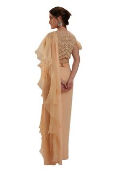 Peach pre-draped saree in georgette base. Paired with a blouse intricate cutdana, sequin, moti embroidery, fringed sleeves and an embellished belt. - Aza Fashions Pre-draped Blouse Piece With Zari Work For Reception, Georgette Blouse With Draped Sleeves For Receptions, Pre-draped Georgette Blouse Piece For Reception, Hand Embellished Pre-draped Saree With Cape Sleeves For Reception, Gold Georgette Pre-draped Saree With Cutdana, Pre-draped Georgette Saree With Pearl Embroidery, Peach Georgette Pre-draped Saree For Wedding, Elegant Peach Pre-draped Saree, Festive Peach Georgette Pre-draped Saree