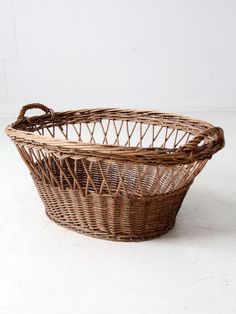 a wicker basket sitting on top of a white floor