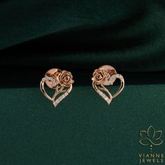 "Infuse your style with the romantic essence of our 'Romantic Bloom' earrings, a poetic union of nature's beauty and artisanal craftsmanship. Each stud is an emblem of love, featuring a delicate rose meticulously sculpted in lustrous rose gold, nestled within an open heart adorned with twinkling lab-grown diamonds. These studs celebrate love's eternal bloom with their heart-shaped silhouette, an enduring symbol of affection and devotion. The rose, traditionally associated with romance and passio Luxury Rose Gold Flower Earrings For Gift, Elegant Rose Design Earrings For Gift, Elegant Rose Earrings For Mother's Day, Rose Gold Flower-shaped Earrings For Anniversary, Elegant Earrings For Mother's Day, Elegant Flower-shaped Earrings For Valentine's Day, Elegant Rose Gold Heart Earrings Pierced, Elegant Heart-shaped Flower Earrings For Gifts, Elegant Rose Design Earrings For Valentine's Day