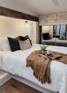 This RV Bedroom Renovation Went from Dark & Dingy to a Serene Suite Camper Master Bed Remodel, Rv Bedroom Slide Out Remodel, Rv Bedroom Makeover, Rv Bedroom, Rv Renovation, Rv Bunk House Remodel, Rv Bedroom Ideas, Rv Bunkhouse Remodel, Rv Remodel Bunkroom