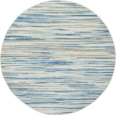 a round rug with blue and white stripes