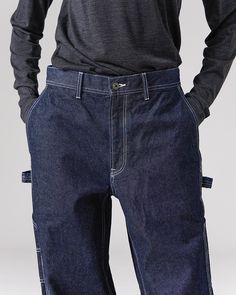 The Recycled Cotton Denim Wide Pants are heavy-weight denim utility pants. The pants feature slanted pockets at the waist, open-top pockets on the back, tool pockets and loops at the thigh on both sides, elastic shirring at the waist, and belt loops. The material is a 12.6oz recycled denim with reinforced stitching. Rigid Denim Bottoms With Patch Pockets For Streetwear, Denim Blue Bottoms With Tapered Leg And Cargo Pockets, Utility Wide Leg Recycled Denim Jeans, Utility Tapered Leg Bottoms With Five Pockets, Utility Wide-leg Recycled Denim Jeans, Denim Blue Tapered Leg Bottoms With Cargo Pockets, Dark Wash Cargo Jeans With Pockets In Rigid Denim, Denim Blue Tapered Leg Cargo Jeans With Belt Loops, Dark Wash Denim Pants With Hip Pockets