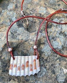 Drilled Shell Necklace with Copper and Leather. Perfect for the Nature / Beach Lover! Necklace is approximately 23 1/2" long and Main Focal is 1 1/2" wide and 15/16" tall. This Necklace would pair well with this shell bracelet: https://monkeyliondesigns.com/products/seashell-and-woven-copper-bracelet-adjustableCopper components have been antiqued, polished and sealed. Sealed with Protectaclear. ProtectaClear is a clear, protective coating that is tough enough to protect jewelry and is safe for w Cryptid Cosplay, Diy Shell Jewelry, Seashell Jewelry Diy, Jewelry Wrapping, Lover Necklace, Shell Crafts Diy, Seashell Jewelry, Necklace Ideas, Polymer Crafts