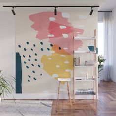 an abstract painting with pink, yellow and blue colors on a white background wall mural