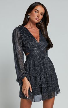 Get ready to turn heads at your next party night with the Elaine Mini Dress. This playful and flirty dress features long sleeves and a plunging neckline, perfect for showing off your curves. The tiered plisse design adds texture and movement to the dress, while the gunmetal grey color adds a touch of sophistication. Made from high-quality polyester, this mini dress is not only stylish but also comfortable to wear all night long. Whether you're hitting the dance floor or sipping cocktails with fr Holiday Long Sleeve Sequin Mini Dress, Holiday Long Sleeve Shimmer Mini Dress, Holiday Metallic Sequin Long Sleeve Dress, Metallic Long Sleeve Shimmer Mini Dress, Metallic Long Sleeve Sequin Mini Dress, Holiday Party Dress, Plisse Fabric, Plisse Dress, Nye Outfits