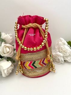 Handcrafted Potli Bags with beaded chains/ Evening Bags/ Embroidered Handbags/ Potli pouch/Potli Purse Size: 13cm X 21cm All items are shipped from Brampton, Ontario, Canada. If you need your item by a certain day, please reach out to us for express delivery option  so that we can update the shipping for you We kindly request to consider minor variations in colors, shades, textures as pictures displayed may slightly vary from the actual product due to digital image limitations. Please expect the Pink Handwork Pouch Bag, Festive Pink Embroidered Shoulder Bag, Festive Pink Handcrafted Shoulder Bag, Multicolor Handwork Bags For Celebration, Traditional Beaded Rectangular Pouch, Traditional Beaded Shoulder Bag As Gift, Beaded Gold Potli Bag, Festival Beaded Clutch Bag, Festival Beaded Potli Bag As A Gift