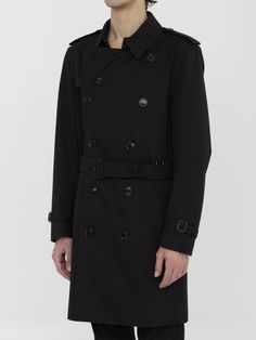 Heritage Kensington medium trench coat in black water-repellent cotton gabardine. It features epaulettes, hook closure on collar, double-breasted button closure, detachable belt at waist, two side buttoned welt pockets, belted cuffs, buttoned back vent and Burberry Check lining. Regular fit. Size nationality: IT Product number: 134001 Product code: 8079386A1189 Composition: 100% cotton Black Belted Business Outerwear, Black Belted Gabardine Outerwear, Belted Black Gabardine Outerwear, Black Belted Outerwear For Business, Classic Black Raincoat For Winter, Black Double-breasted Belted Pea Coat, Black Gabardine Long Coat, Black Belted Double-breasted Pea Coat, Black Double-breasted Belted Outerwear