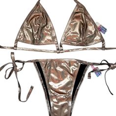 Nwt $150 Liquid Bronze Bikini By Bottoms Up Bikinis M Bold Liquid Bronze Medal Statement Bikini Triangle Top / High Side Tie Bottoms Bikini. Lined / Polyester Elastin Ties Behind Neck And Back Interesting Cutout Base Of Triangle / Just A Peek At Some Skin. Head Turner At Luxury Resorts, Beach, Yacht Parties, Wear The Top Under A Jean Jacket Or Cardigan Minimalist Modern Edgy High-End Fitted T-back Swimwear For Club, Metallic Triangle Top Swimwear For Poolside, Metallic Triangle Top Swimwear For The Pool, Gold Tie-side Bottom Swimwear For Swimming, Metallic Triangle Top Swimwear For Beachwear, Gold Swimwear With Lined Body For Beach, Metallic Triangle Top Swimwear For Parties, Metallic Swimwear For Poolside Summer, Metallic Swimwear For Poolside In Summer