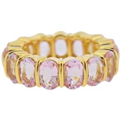 18k gold wedding band ring by Gemlok, set with a full circle of oval kunzite gemstones , measuring approx. 7 x 4.8mm. Ring size - 7, ring is 7mm wide. Marked: 750, Gemlok. Weight - 14.1 grams. 7 Ring, Eternity Wedding Band, Wedding Band Ring, Full Circle, Gold Wedding Band, Gold Wedding, Tiffany & Co., Wedding Ring Bands, Band Ring