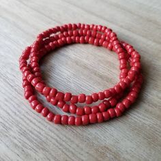 These bracelets are made up of glass seed beads in an opaque red color. Perfect for stacking together, wearing alone, or pairing with a chunky bracelet. The options are endless! (Bracelets sold individually) Great as gifts! Size shown: 7 inches Strung on pre-stretched bracelet material. CUSTOMIZATION If you are interested in seeing this bracelet in another color not represented in the shop, please message me via conversations. I would love to help! SIZING The sizing chart is the standard for str Red Bohemian Beaded Bracelet, Red Hand-strung Friendship Bracelets With Round Beads, Hand-strung Red Friendship Bracelets With Round Beads, Red Beaded Friendship Bracelets, Red Beaded Bracelets With Spacer Beads For Beach, Red Wrap Bracelet With Round Beads For Gift, Red Beaded Stretch Bracelet, Red Bracelets With Tiny Round Beads, Red Beaded Bracelets For The Beach