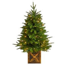 Create your own mini Christmas wonderland and rock around with this Artificial Christmas Tree. Incredibly lifelike textured branches mimic real evergreens for a sturdy construction. This pre-lit artificial Christmas tree comes with 50 clear lights and has upward-sloping branches  allowing you to decorate with mini-ornaments of your choice easily. Standing 3ft. from a decorative planter, this tree requires zero maintenance, just some fluffing and shaping thats easy with the bendable branches! Dec Faux Christmas Trees, Warm White Lights, Fir Christmas Tree, Pre Lit Christmas Tree, Cone Trees, Mini Ornaments, Christmas Greenery, White Lights, Christmas Wonderland