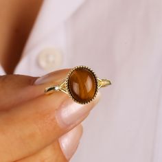 This minimalist tigers eye ring will be a perfect gift as a christmas for your best friend.Tigers eye ring with made of gold plated 18 karat .925 sterling silver. The meaning of Tigers Eye is self-confidence and inner strength. Minimalist tigers eye will be a best gift idea for your mom or your loved ones as a birthday gift or anniversary gift.A perfect Christmas gift as a handmade jewellery.You will add light to your elegance with this handmade crafted ring model, modern look and design with di Tigers Eye Wedding Ring, Tigers Eye Rings, Womens Tigers Eye Rings, Tiger Eye Stone Jewelry, Tiger Eye Gemstone, Birthday Gift Ring, Tigers Eye Gem, Tiger Eye Earrings, Brown Gemstone