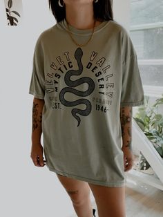 These tees are printed on super soft Comfort Colors, providing a relaxed unisex fit with a worn-in look and feel. This collection offers our most expanded size range from S-3X.Looking for these tees to fit oversized? Size up 1-2 sizes.Model is wearing a size XL for an oversized fit• 100% ring-spun cotton• Garment-dyed• Relaxed fitThis product is made especially for you as soon as you place an order, please see the banner on the top of our site for current turnaround times. Making products on dem Comfortable Graphic Print T-shirt, Comfortable Crew Neck Top With Graphic Print, Everyday Acid Wash Graphic Tee, Comfortable Streetwear Crew Neck T-shirt, Comfortable Crew Neck T-shirt For Streetwear, Acid Wash Text Print Casual T-shirt, Acid Wash T-shirt With Front Print And Crew Neck, Casual Acid Wash Text Print T-shirt, Comfortable Streetwear T-shirt With Graphic Print