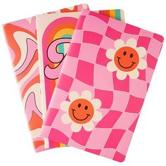 three notebooks with different designs on them, one is pink and the other is orange