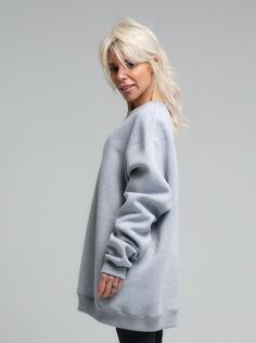 Elevate your casual wardrobe with the chic simplicity of our Relaxed Fit Viscose Sweatshirt. Crafted from luxuriously soft and sustainable viscose fabric, this sweatshirt offers an eco-friendly option that does not compromise on style or comfort. Designed for the modern woman on the go, the light heather grey hue complements a wide array of looks, seamlessly transitioning from your morning run to a casual coffee date.. FEATURES:A relaxed, oversized silhouette for a modern and effortless style. The drop shoulder design adds a laid-back charm, while the ribbed cuffs provide structure to the loose form.100% Handmade. SIZE & FIT: Fit: A relaxed fit with room to moveModel is wearing size Small or S/M View our SIZE CHART before ordering MATERIALS & CARE: Content: 65% Cotton, 35% Polyester Care: Gray Relaxed Fit Fleece Sweater, Gray Long Sleeve Athleisure Sweater, Versatile Crew Neck Tops With Ribbed Cuffs, Versatile Everyday Cotton Sweatshirt, Versatile Cotton Sweatshirt For Everyday, Gray Long Sleeve Tops For Daywear, Basic Fleece Sweater For Loungewear, Relaxed Fit Fleece Sweater, Basic Relaxed Fit Fleece Sweater