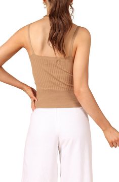 Effortlessly chic whether layered or solo, this V-neck tank is knit in a slinky rib stitch in a fitted silhouette. V-neck 45% polyester, 32% viscose, 23% nylon Hand wash, dry flat Imported Summer V-neck Crop Top For Layering, Beige Ribbed V-neck Top, Seamless V-neck Tank Top For Day Out, Summer Ribbed Tank Top, Ribbed Tank Top For Day Out, Chic Brown V-neck Knit Top, Trendy Fitted Beige Tank Top, Beige Spring Tank Top With Built-in Bra, Beige Tank Top With Built-in Bra For Spring