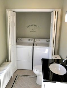 a washer and dryer in a small bathroom