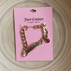 Juicy Couture Gold Bracelet This Bracelet Makes A Statement. Literally!! You’ll Make A Statement Too, Wearing A Classy Bracelet Like This On Your Wrist. + Features: Thick Gold Chain, Curved Bar With “Juicy Couture” Written On It, Lovely Pink Heart Charm, Lobster Claw Closure With Extender New With Tag! Pink Chunky Chain Jewelry For Party, Pink Chain Bracelet As A Gift, Trendy Pink Chunky Chain Jewelry, Trendy Pink Chain Bracelet With Adjustable Chain, Trendy Pink Adjustable Chain Bracelet, Juicy Couture Bags Handbags, Pink Jewerly, Maching Tattoos, Thick Gold Chain