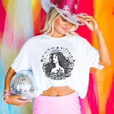 We love this fun, colorful unisex Vintage Mermaid design T-shirt! This tee is soft and super comfy and is made of 100% cotton. Heather tees are a soft cotton-poly blend. We use BELLA+CANVAS for our T-shirts! FABRICATION * Solid Colors: 100% Ringspun Cotton * Heather Colors: 52% cotton, 48% polyester * Runs true to size SIZING This style is a unisex t-shirt. If you are unsure about the size you should order, please refer to the size chart in the pictures. CARE INSTRUCTIONS * Machine wash: warm (m Fun Unicorn Print T-shirt For Summer, Summer Unicorn Print Crew Neck T-shirt, Summer Unicorn Print Crew Neck Top, Summer Crew Neck Top With Unicorn Print, Unicorn Print Crew Neck Graphic Tee, White Unicorn Print T-shirt For Summer, White Unicorn Print Crew Neck Top, Summer White T-shirt With Unicorn Print, Fun Summer T-shirt With Unicorn Print