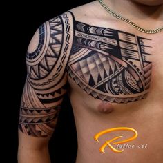 a man's chest with an intricate tattoo design on his arm and chest area