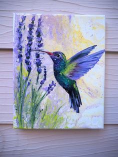 a painting of a hummingbird in flight with lavender flowers on the side of a house