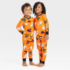 Create a cool, comfy look for Halloween with this Ghost Print Glow-in-the-Dark Halloween Matching Family Pajama Set from Hyde & EEK! Boutique™ in Orange. Made from 100% cotton knit fabric for comfortable wear, this set includes a short-sleeve tee and a pair of ghost print pajama pants for a coordinated ensemble. The full elastic waistband on the pajama pants offers a customizable fit, while pullover closure lends them functional flair. Wear the pieces together or mix and match with other sleep s Cute Halloween Onesie For Loungewear, Casual Halloween Onesie For Sleep, Playful Orange Long Sleeve Sleepwear, Casual Halloween Onesie For Loungewear, Cute Cotton Halloween Sleepwear, Playful Onesie For Fall Loungewear, Long Sleeve Sleepwear For Halloween Playtime, Casual Halloween Loungewear Onesie, Playful Pajama Party Sets For Fall